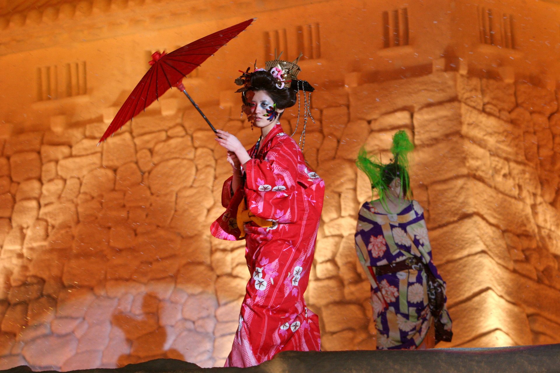 Fashion show in front of a snow sculpture